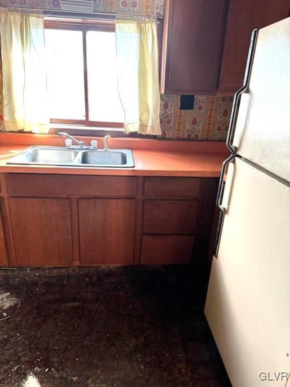 kitchen with white fridge and sink