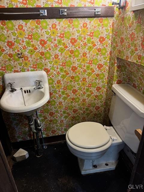 824 Wolf Ave, Easton, PA 18042 - half bathroom featuring wallpapered walls, toilet, and baseboards
