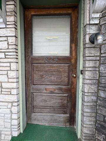 824 Wolf Ave, Easton, PA 18042 - doorway to property with brick siding and stone siding