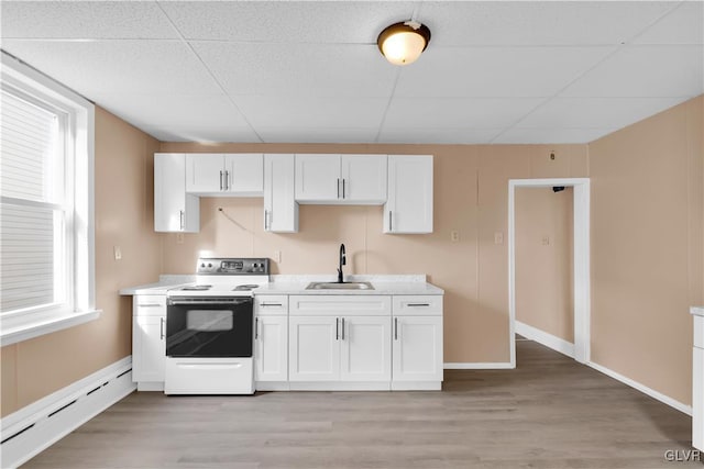 kitchen featuring white cabinets, sink, light hardwood / wood-style flooring, a baseboard radiator, and white electric range oven