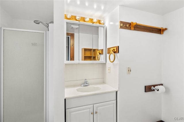 bathroom with an enclosed shower and vanity