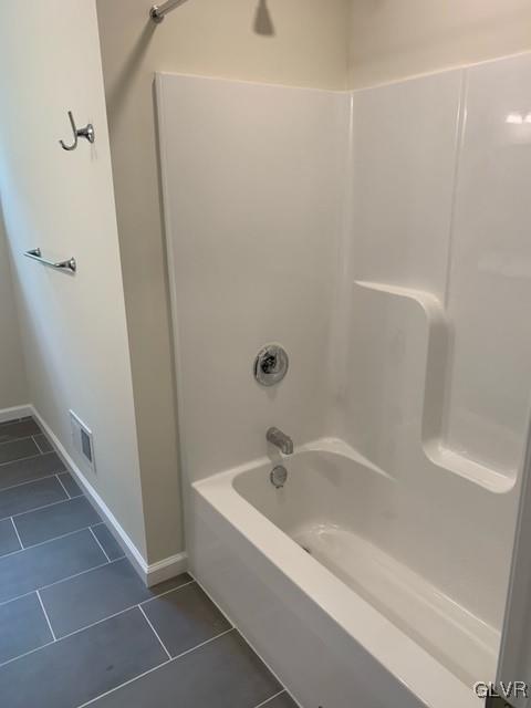 bathroom with shower / tub combination and tile patterned floors