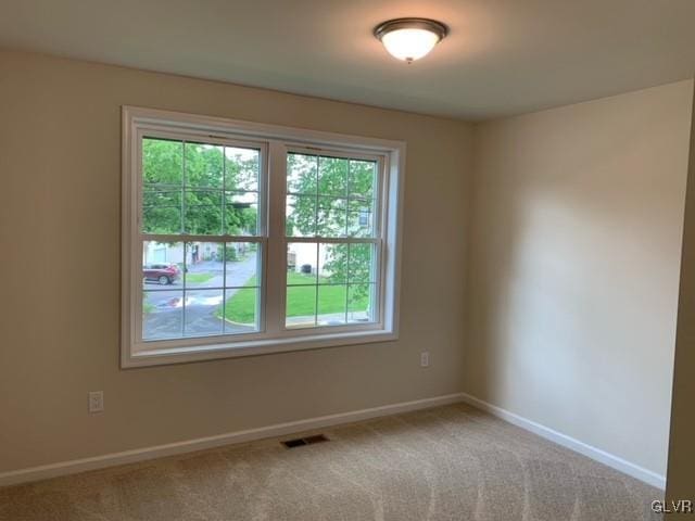 empty room featuring carpet floors