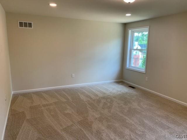 unfurnished room featuring carpet floors