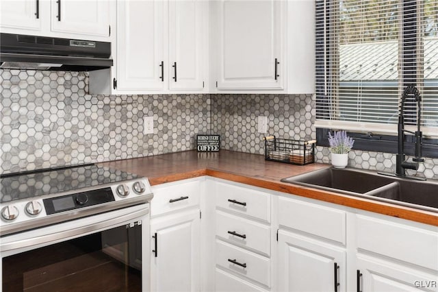 kitchen featuring white cabinets, backsplash, stainless steel electric range oven, and sink