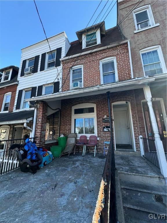 townhome / multi-family property with covered porch