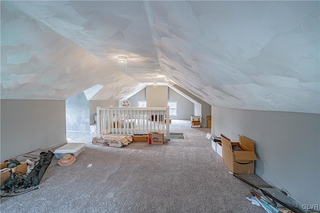 bonus room featuring carpet flooring and vaulted ceiling