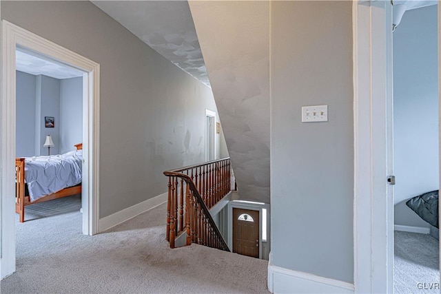 staircase with carpet floors