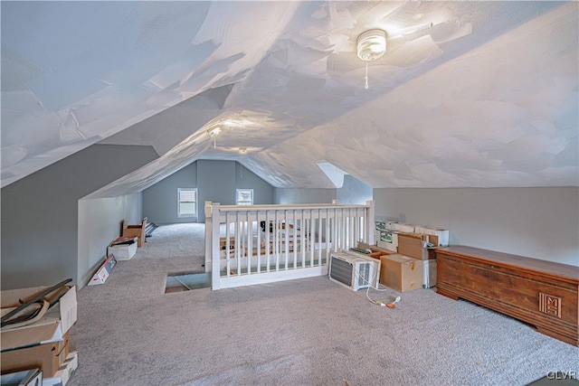 carpeted bedroom featuring ceiling fan and lofted ceiling