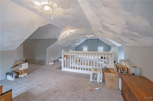 carpeted bedroom featuring lofted ceiling