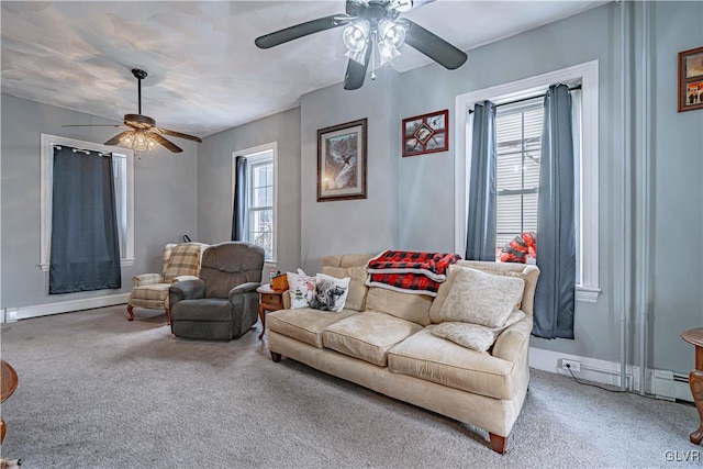 living room with carpet flooring, baseboard heating, plenty of natural light, and ceiling fan