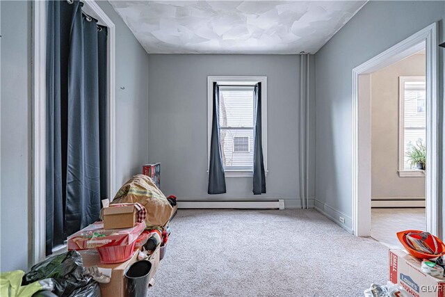 playroom featuring carpet and a baseboard radiator