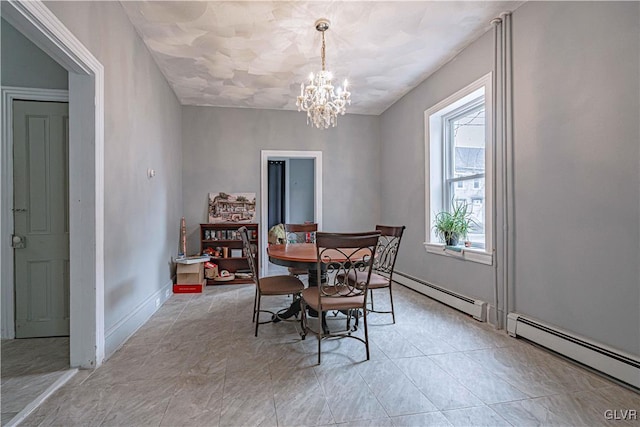 dining room with a baseboard radiator and an inviting chandelier