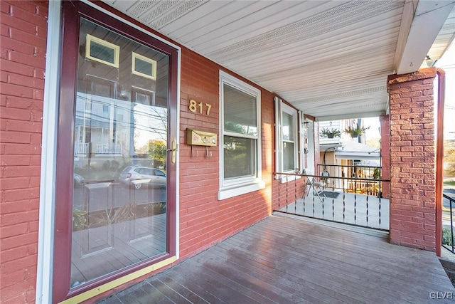 wooden terrace with a porch