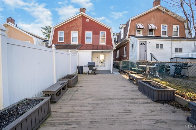 rear view of house with a wooden deck