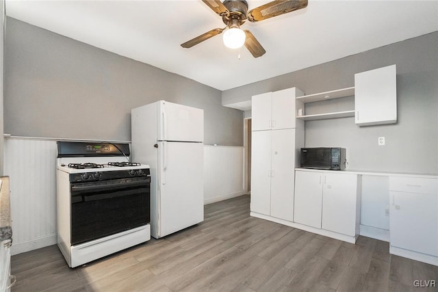 kitchen featuring white cabinetry, ceiling fan, white appliances, and light wood-type flooring