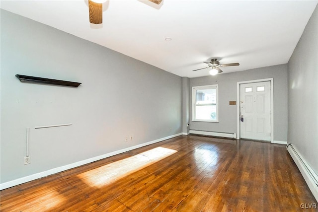 interior space with baseboard heating, ceiling fan, and dark hardwood / wood-style flooring