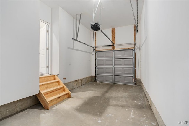 garage featuring baseboards and a garage door opener