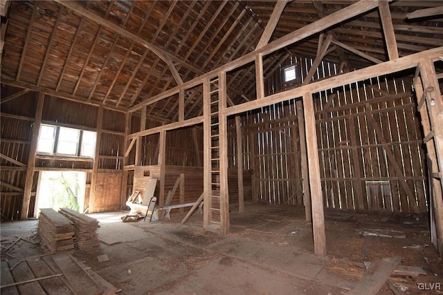 miscellaneous room with high vaulted ceiling