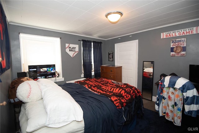 bedroom with carpet flooring and crown molding