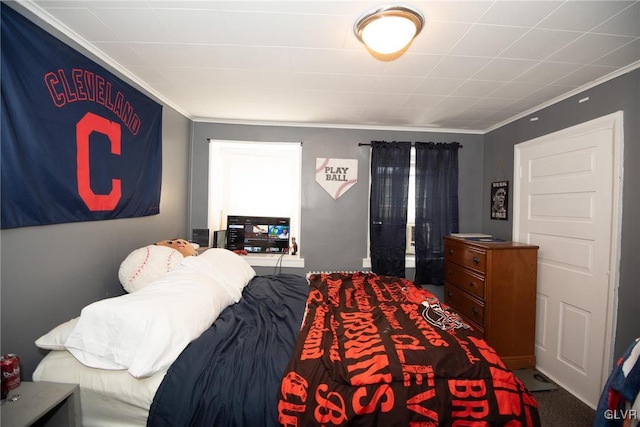 bedroom featuring carpet floors and ornamental molding