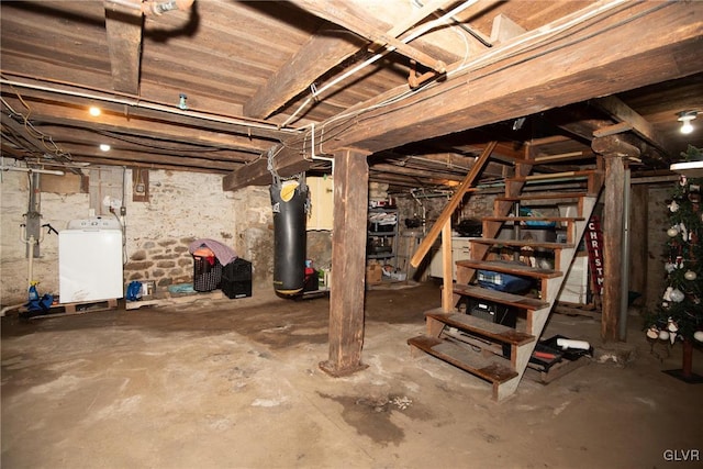 basement with gas water heater and washer / dryer