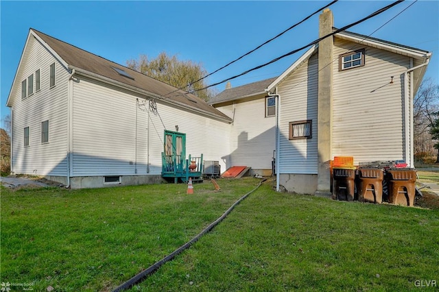 3479 Mango Dr, Lehigh Township, PA 18038 - back of house with a yard and a chimney