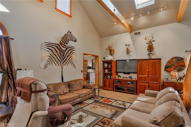 3479 Mango Dr, Lehigh Township, PA 18038 - living area with high vaulted ceiling, a skylight, track lighting, and light tile patterned floors