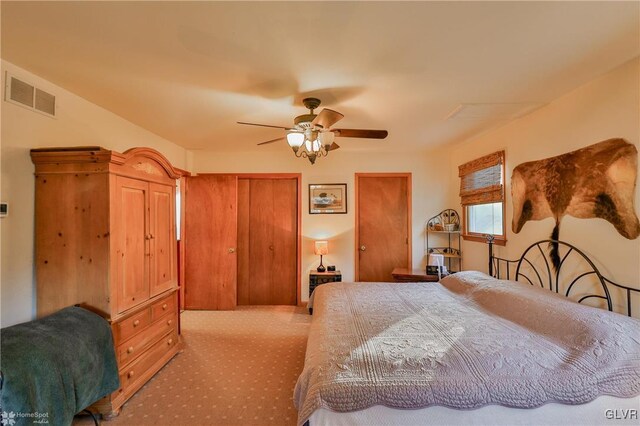 3479 Mango Dr, Lehigh Township, PA 18038 - carpeted bedroom with a ceiling fan and multiple closets