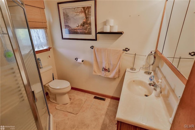 bathroom featuring tile patterned floors, vanity, toilet, and an enclosed shower