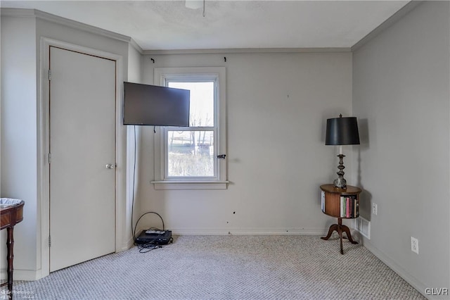 unfurnished living room with light colored carpet and ornamental molding