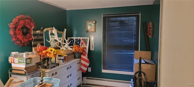 bedroom featuring a baseboard heating unit and ornamental molding