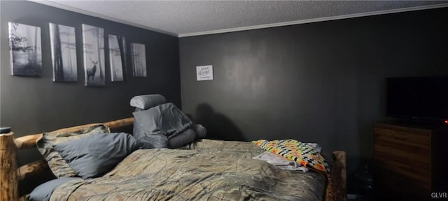 bedroom featuring a textured ceiling and crown molding