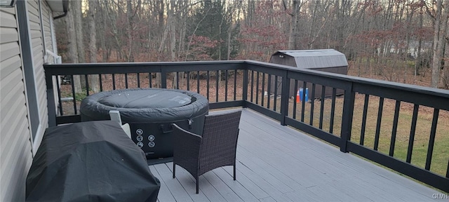 wooden deck with a grill