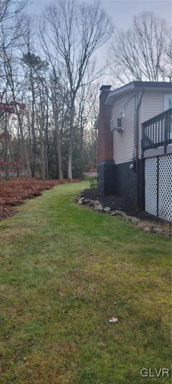 view of yard with a wooden deck