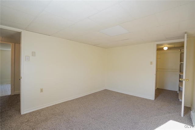 unfurnished room with light carpet