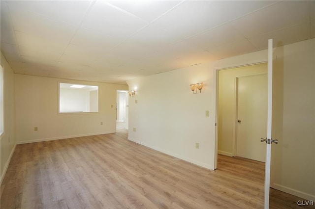 unfurnished room with light hardwood / wood-style floors