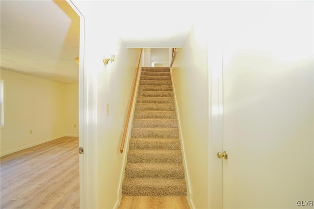 stairway featuring hardwood / wood-style flooring