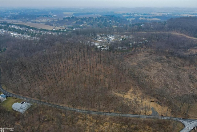 birds eye view of property with a rural view