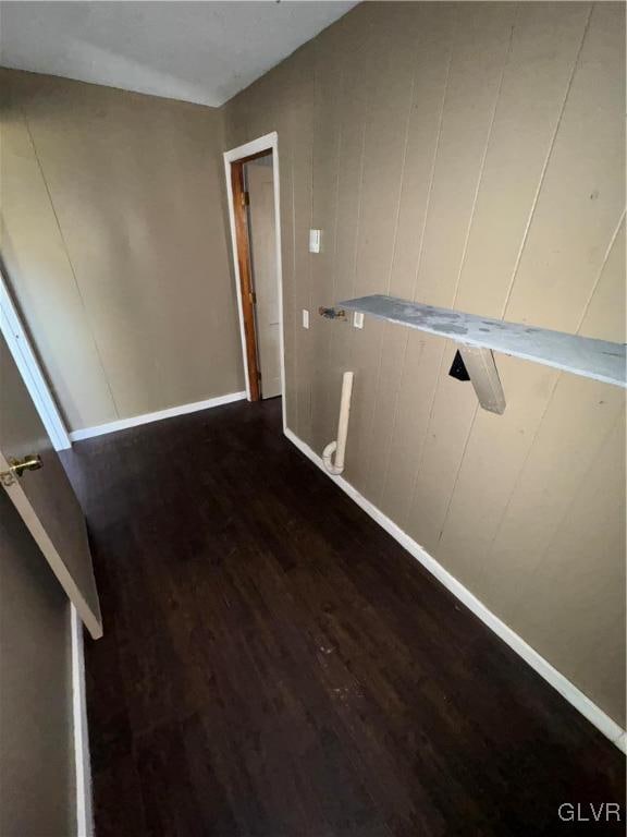 corridor featuring dark hardwood / wood-style floors