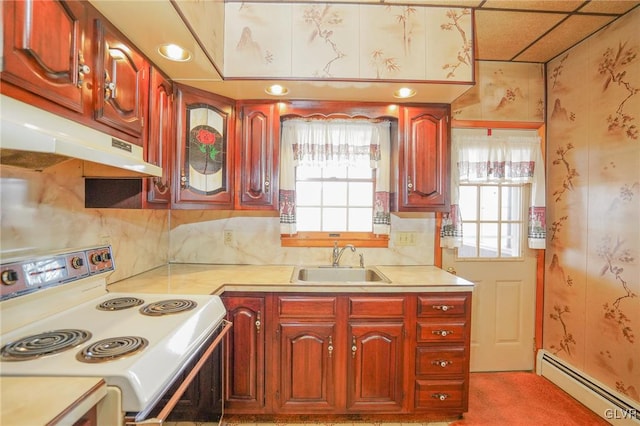 kitchen featuring baseboard heating, electric stove, a wealth of natural light, and sink