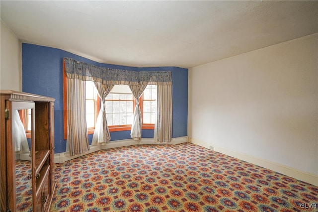 unfurnished room with carpet flooring