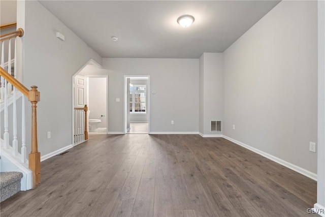 empty room with dark wood-type flooring