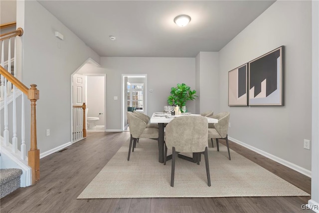 dining area with hardwood / wood-style flooring