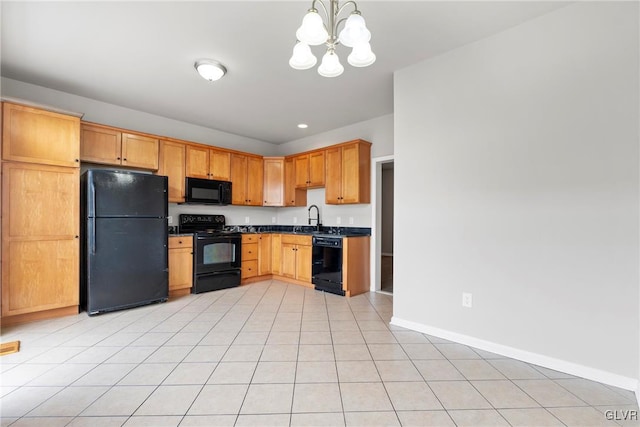 kitchen featuring sink, a notable chandelier, decorative light fixtures, light tile patterned floors, and black appliances