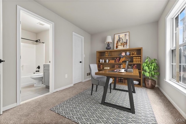 office area featuring carpet floors and a healthy amount of sunlight