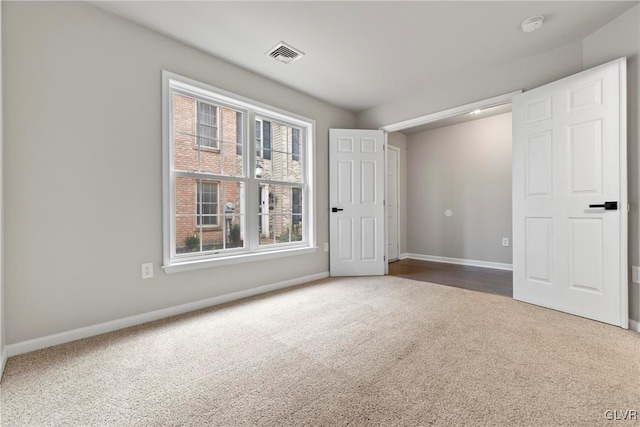 unfurnished bedroom with carpet flooring