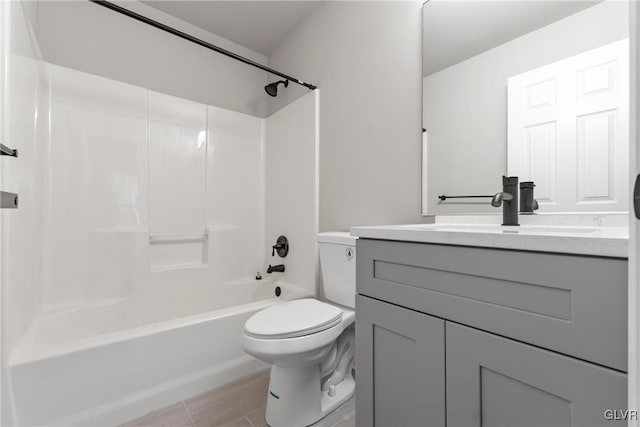 full bathroom with toilet, shower / bathing tub combination, vanity, and tile patterned floors