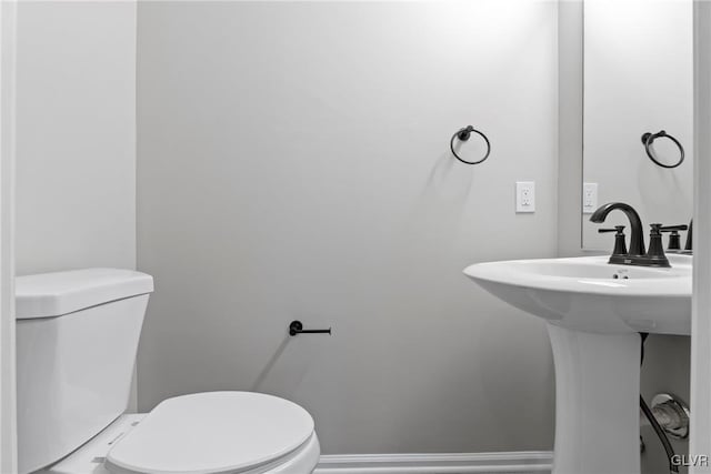 bathroom featuring sink and toilet