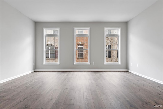 spare room featuring hardwood / wood-style flooring